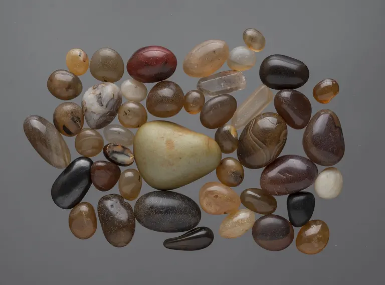Polished pebbles (41), eroded by wind and water, and two crystals, carnelian, quartz, and other semi precious