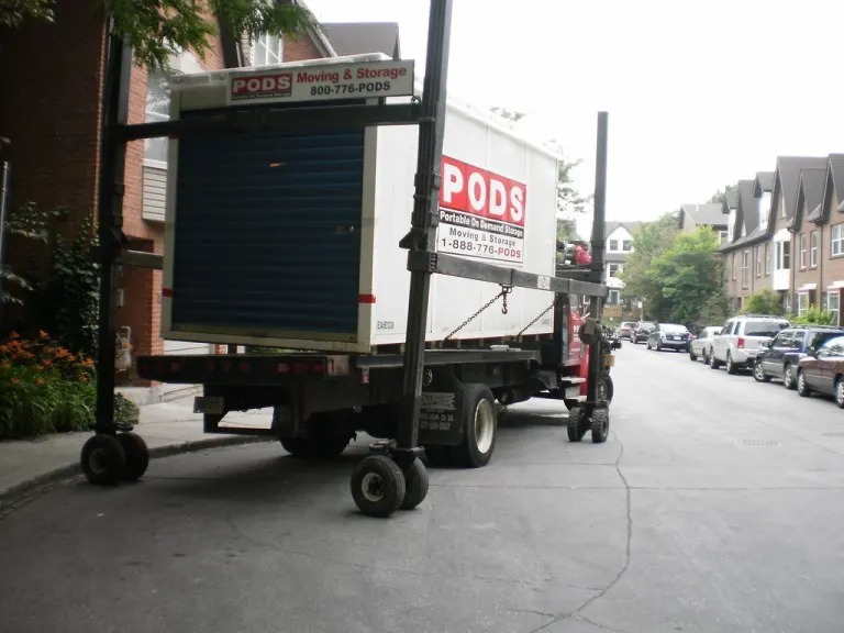 Unloading a shipping container with household contents d