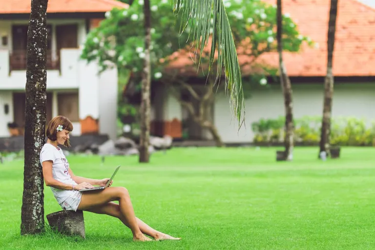 Woman online shopping concept. Woman in the green park with modern laptop. Bali island. (46933867545)
